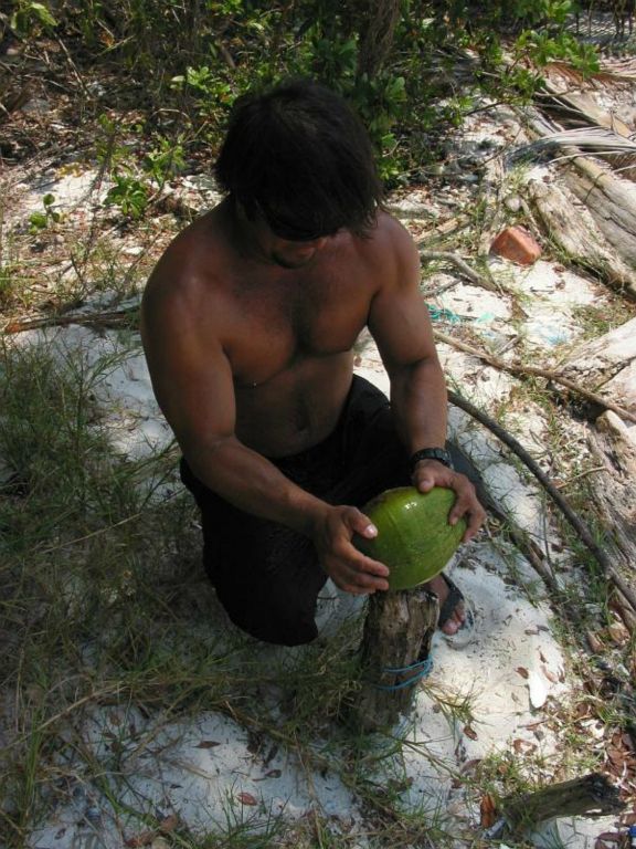 Our guide showing us how to open an coconut