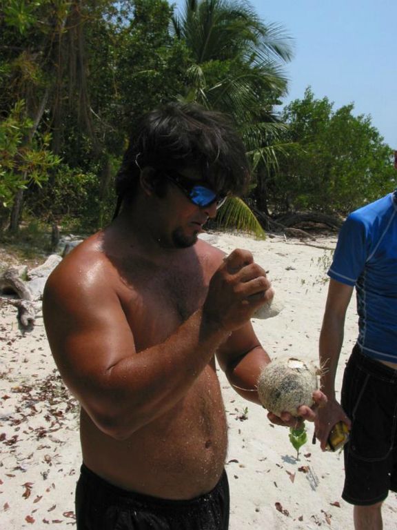 Our guide showing us how to open an coconut