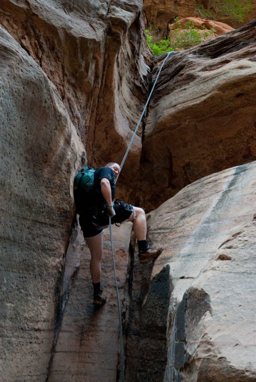 Chad Utterback showing off his ripped shorts on the second to last rappel in Pine Creek