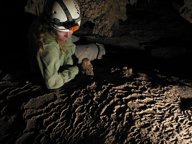 Jennifer Foote studying rimstone in Silverware Cave.