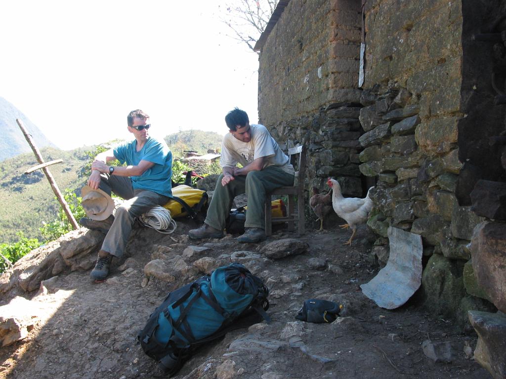 Peter Hartley and Brandon Kowallis making arrangements for a guide to lead us to a cave.