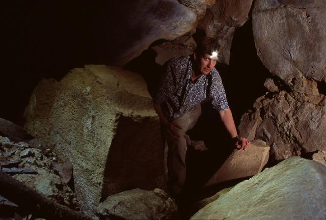 Jon Jasper exploring the short bouldery maze of Cueva de San Felipe los Azati.  Jon had a bit of problems with his luggage being routed to New York thereby using Brandon's spare light.  Photo by Brandon Kowallis.