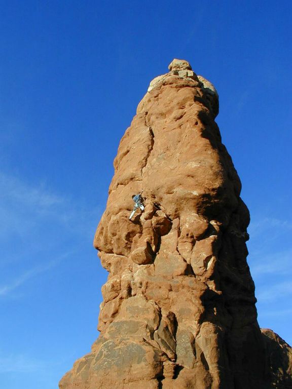 Terry Acomb climbing the Owl in Arches National Park       