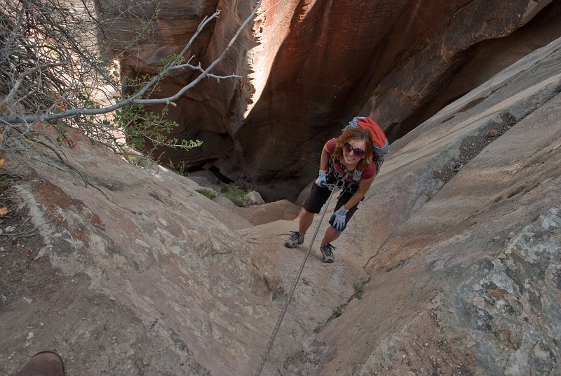 Janel Macy on the 300-ft entrance rappel to Englestead Canyon