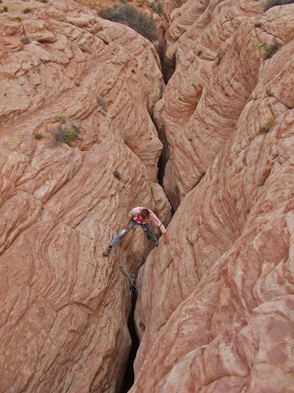 Jon continuing down Little Canyon with Mike buried within the crack.  Photo by Tim Barnhart