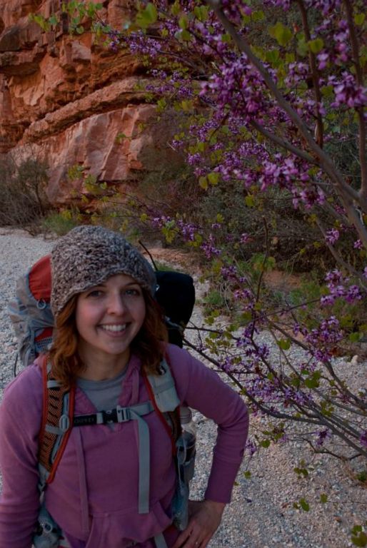 Janel Macy in front of spring blossoms in Havasu Canyon.