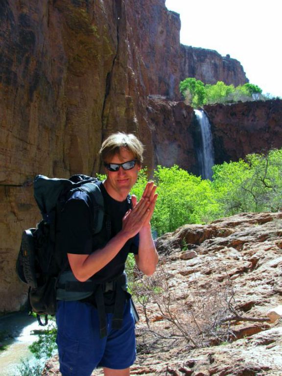 Jon Jasper happy to be hiking within Havasu Canyon.  Jon is front of Mooney Falls.  Photo by Janel Macy.
