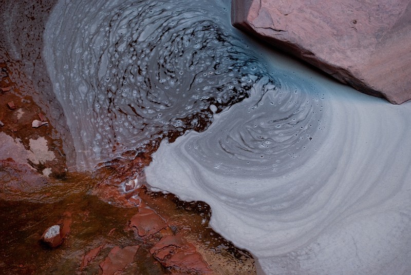 Water swirls at the base of lower falls