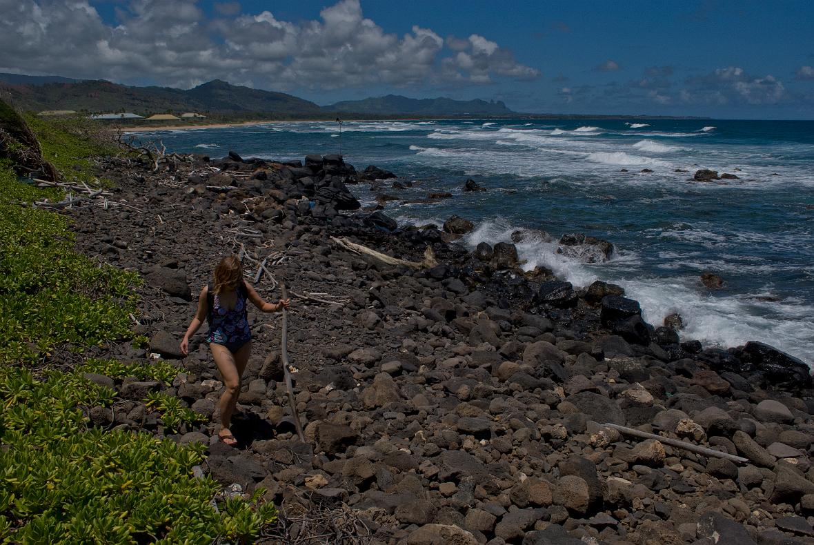Janel Macy walking down the coastline from Kauai Beach Resort.