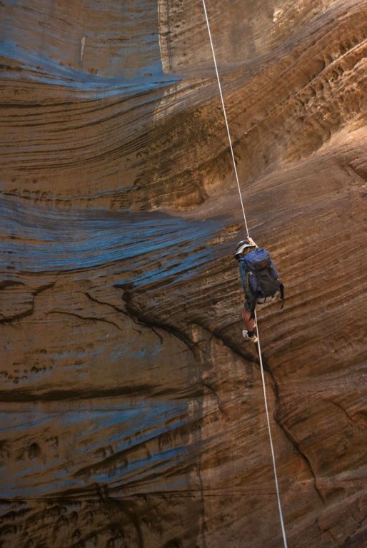 Tim Barnhart finishing the first series of rappels into Behunin Canyon.