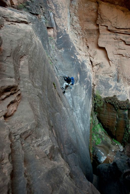 Jason Mateljak rappeling 115 ft to the Mystery Spring in Mystery Canyon.