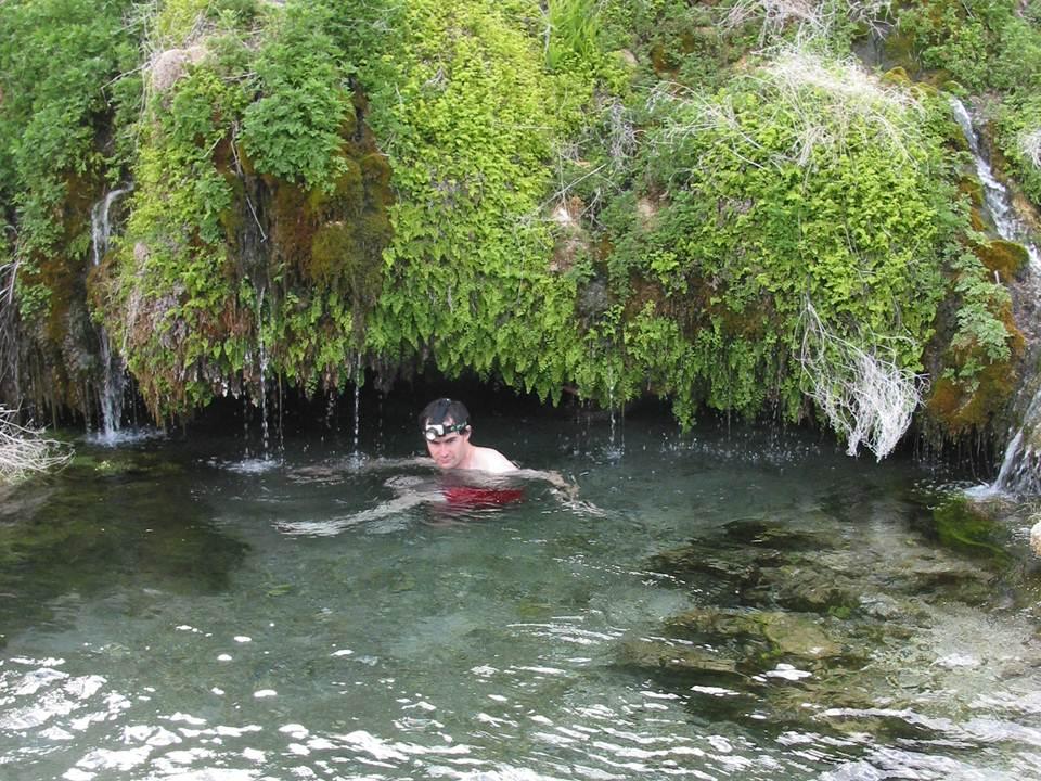 Gandy warm springs or Beware Cave.  Brandon Kowallis swimming through a 80 degree cave