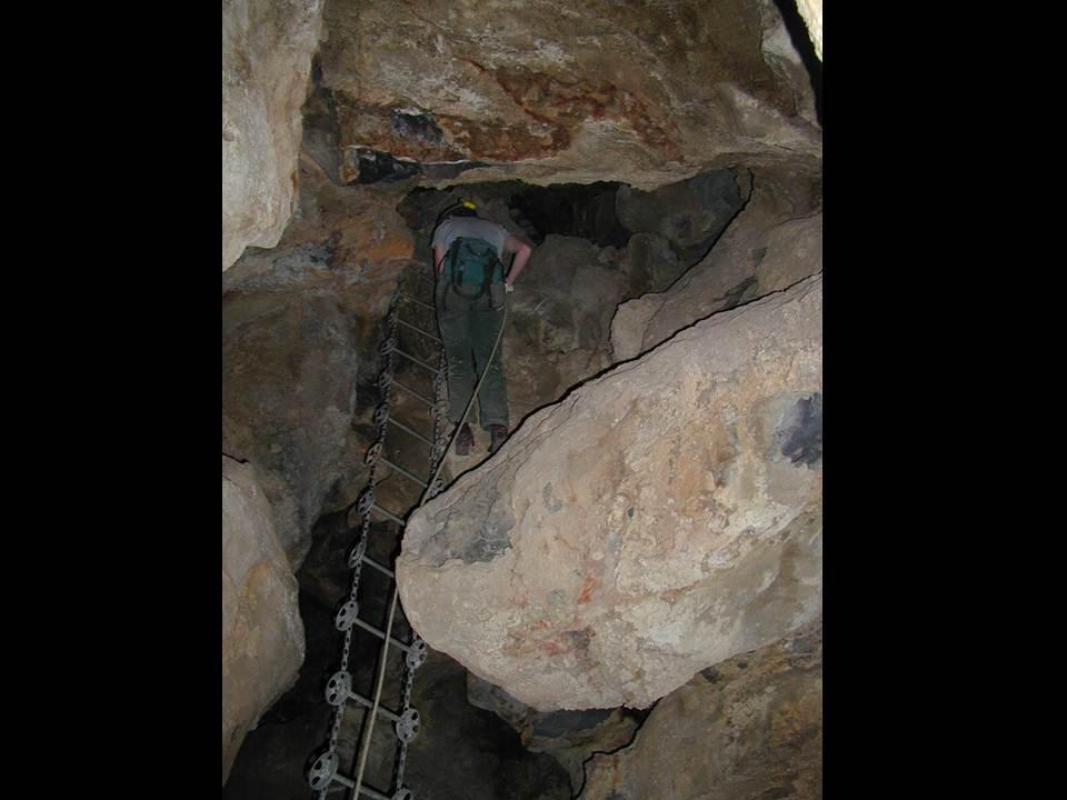 Cami Pulham Rappeling past the ladder left behind from the mining