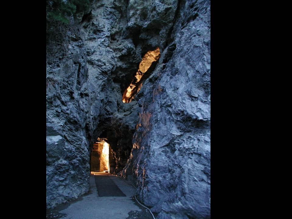 The entrance to Hansen Cave lit by light while installing the cave's gate