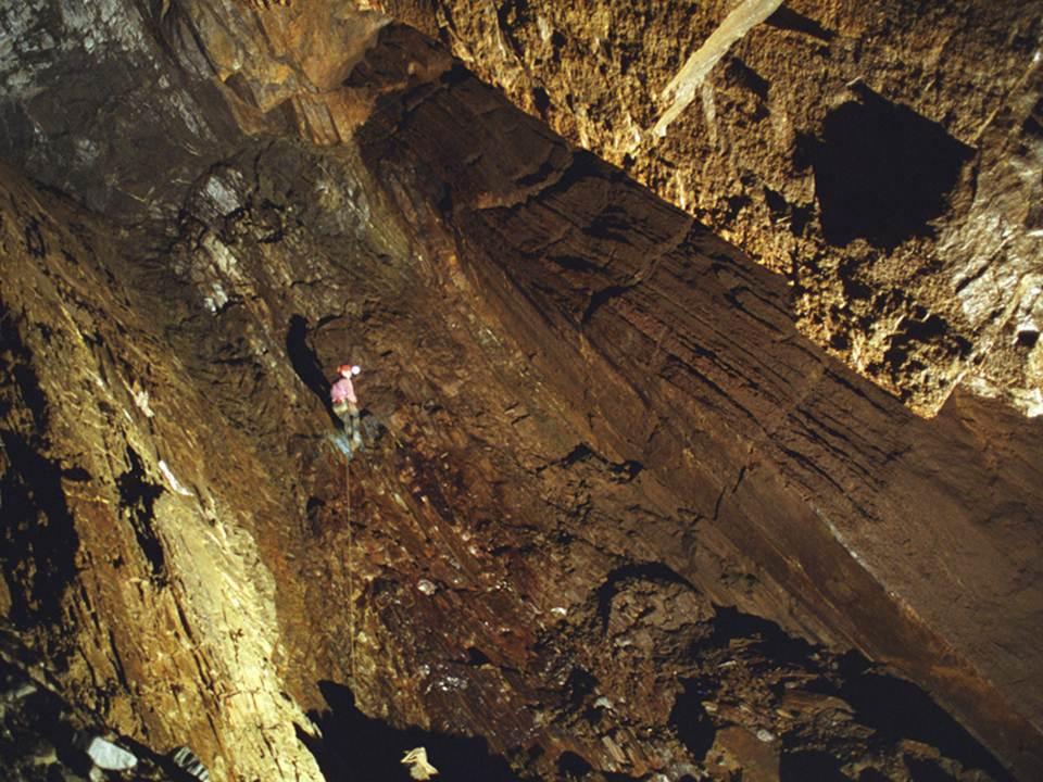 Jon Jasper climbing Neffs Cave's only free rappel, Goodrows Pit.  The cave mostly following the bedding dip.   Brandon Kowallis Photo