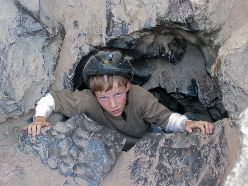 Young kid exiting Nutty Putty Cave.