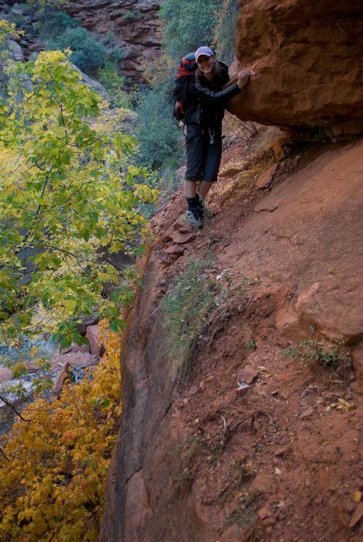 Rachael Keske traversing a ledge around one of the many waterfalls in the Right Fork