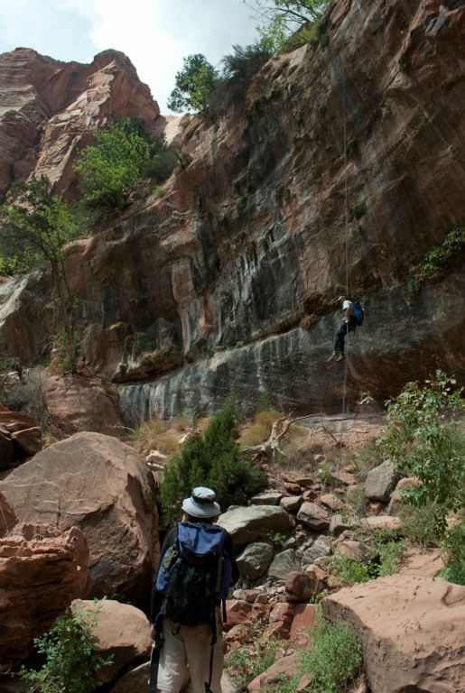 Tim Barnhart watches as Joel Silverman descends the final drop in Spry Canyon.