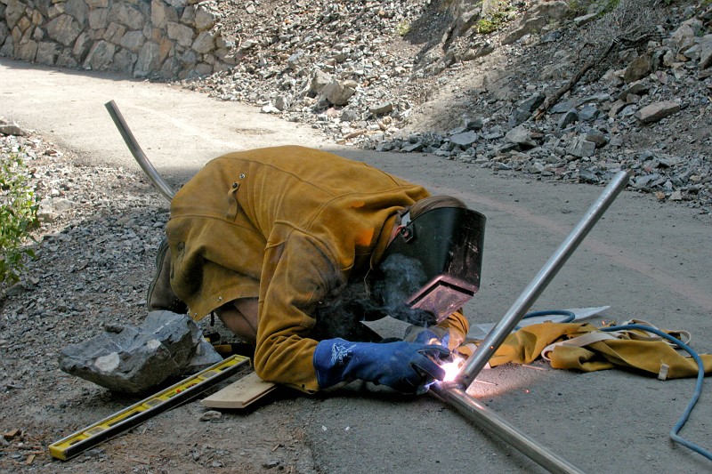 Jon Jasper welding handrails outside of the Timpanogos Cave exit.