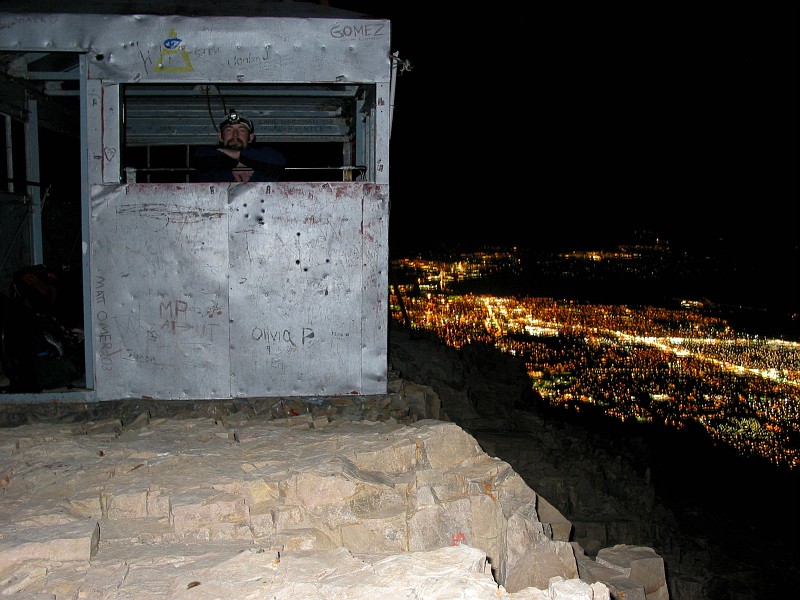 Jason Mateljak in the hut at the top of Mount Timpanogos overlooking Utah Valley