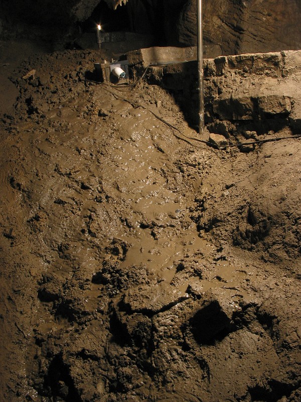 The trail debris (mud) flowing down into the Chimes Chamber