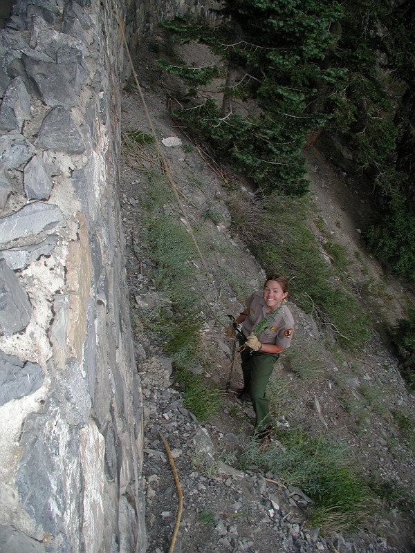 Cami Pulham rappeling down from the Hansen Cave entrance to pull Toadflax.