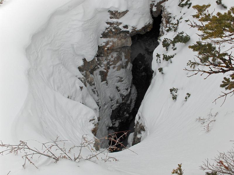 Photo of the entrance to Main Drain Cave in winter.