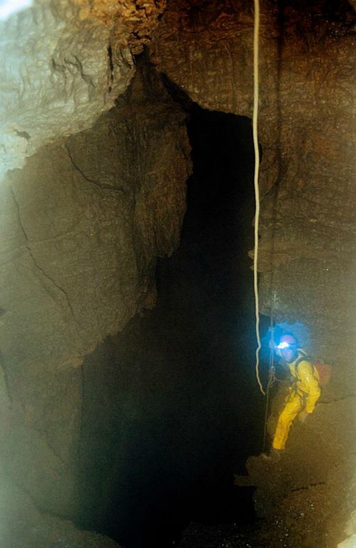 Ryan Shurtz at the top of the third pit in Main drain cave