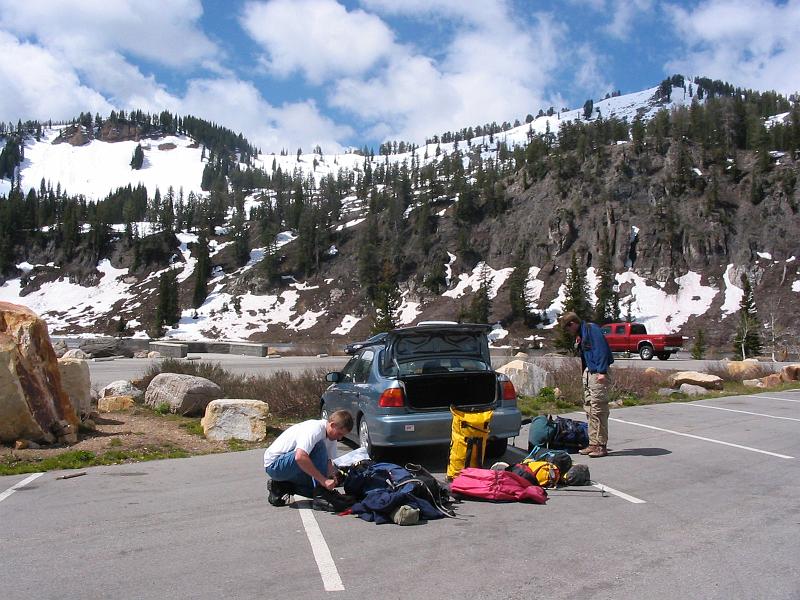 Jacob Snedecor and Shay Lelegren in the parking lot at Tony Grove preparing gear before hiking to Polygamy's End Cave.