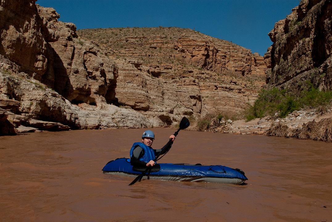 Tim Barnhart boating down the Virgin River just after the first I-15 bridge in the Paiute Wilderness.