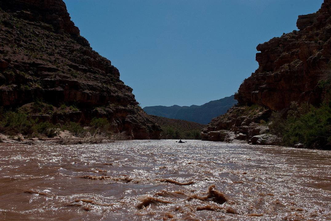 Tim Barnhart boating down the Virgin River just above the Virgin River Canyon Recreation area in the Paiute Wilderness.
