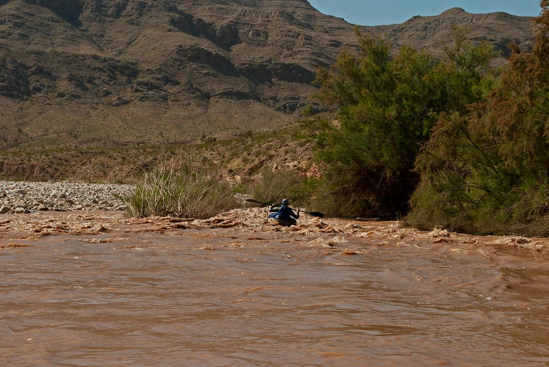 Tim Barnhart boating down the Virgin River at the Virgin River Canyon Recreation area in the Paiute Wilderness.