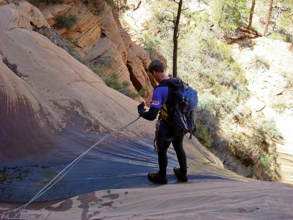 Jon Jasper at top of the 160 ft rappel in Water Canyon.  Photo by Kyle Voyles.