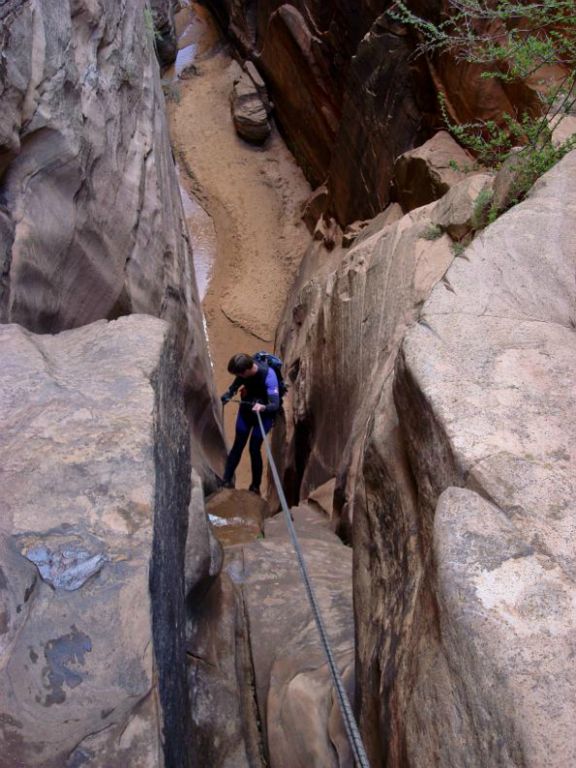 Jon Jasper starting down the 110-ft rappel (the second waterfall)  in Water Canyon. Photo by Kyle Voyles.