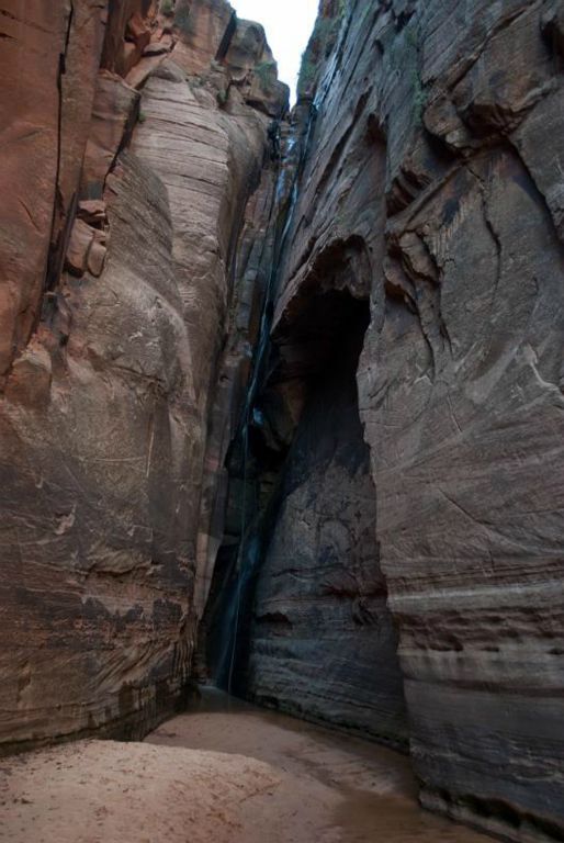 Kyle Voyles starting down the 110-ft rappel (the second waterfall)  in Water Canyon.