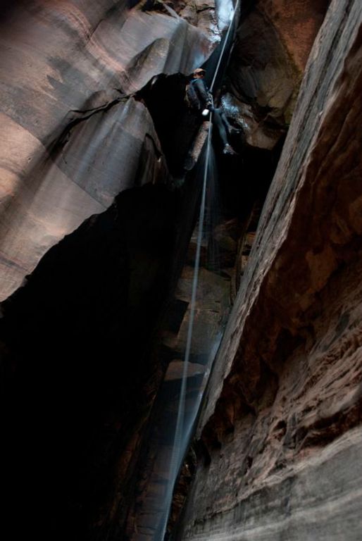 Kyle Voyles at overhang on the 110-ft rappel (the second waterfall)  in Water Canyon.