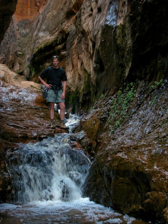 Jon Jasper posing at the cascade in Water Canyon.  Photo by Janel Macy.