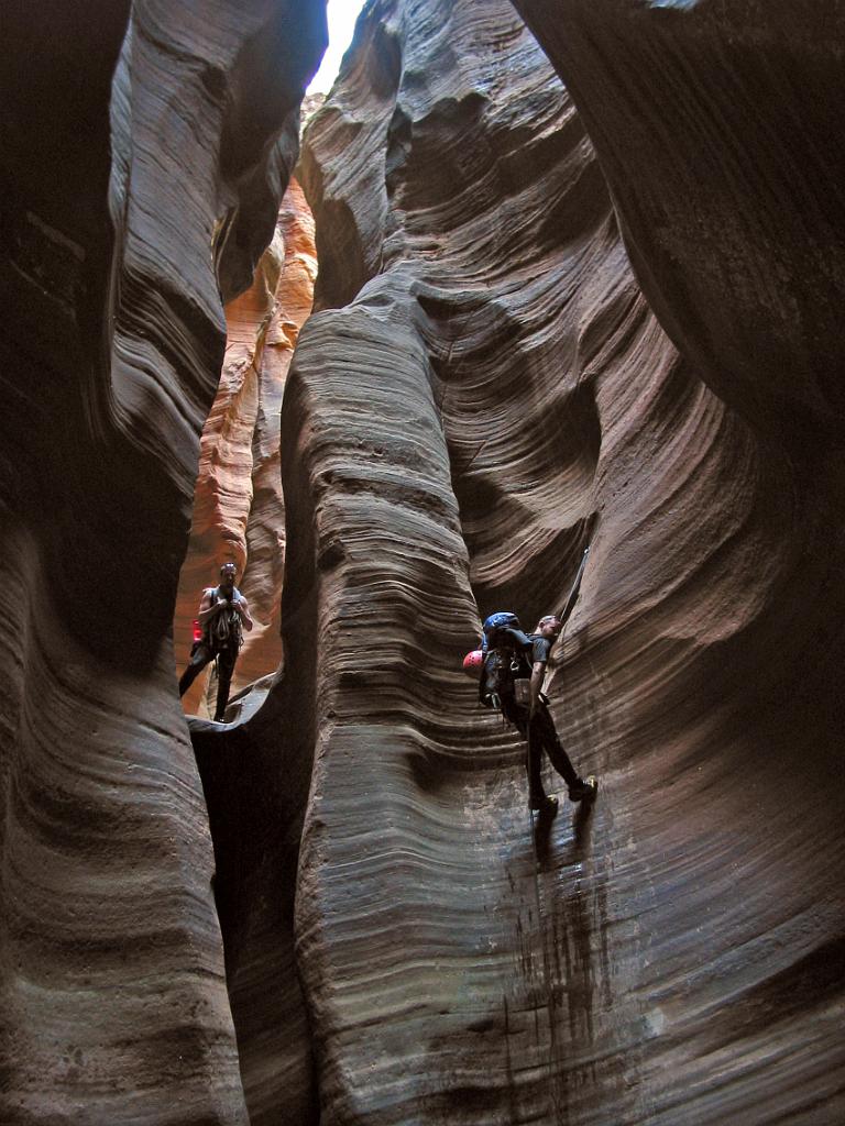 Jason Mateljak and Andrew McKinney on the arch rappel in Imaly Canyon.