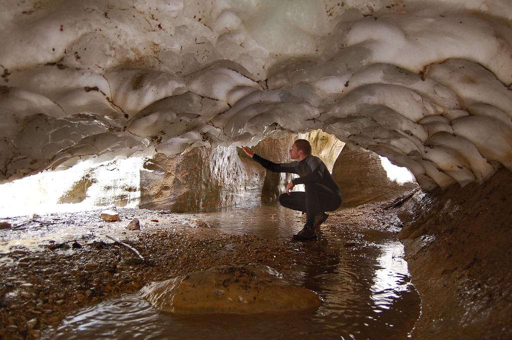 Tim Barnhart inspecting the short ice cave in North fork of Oak Creek Canyon.