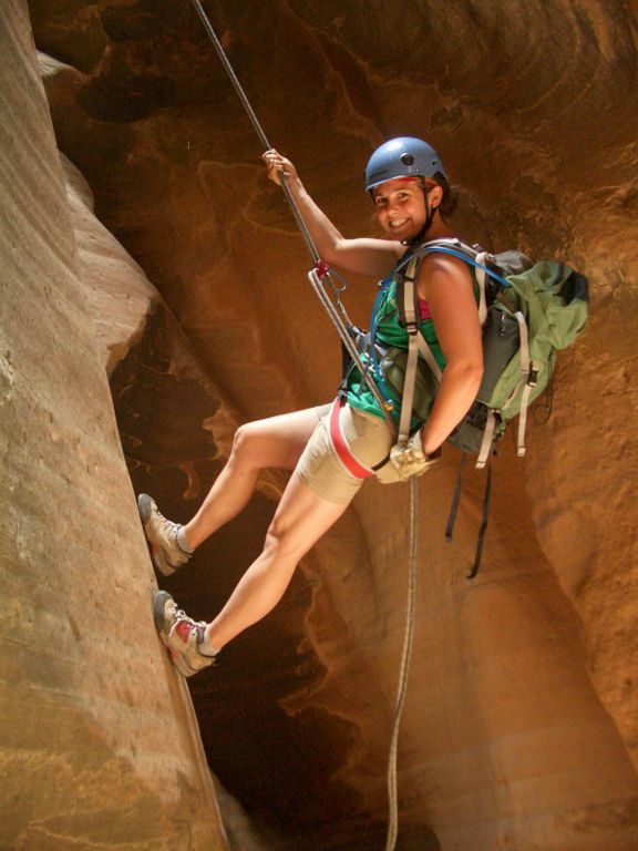 Kate Feller rappeling in Mystery Canyon.    Photo by Megan Porter.