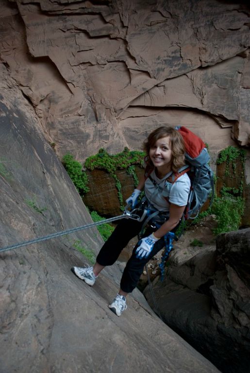 Janel Macy starting down the 115-ft, Mystery Spring rappel in Mystery Canyon