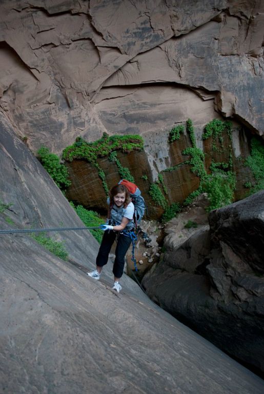 Janel Macy starting down the 115-ft, Mystery Spring rappel in Mystery Canyon