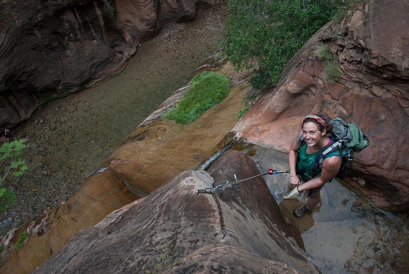 Kate Feller preparing for the 115-ft final rappel into the Zion Narrows