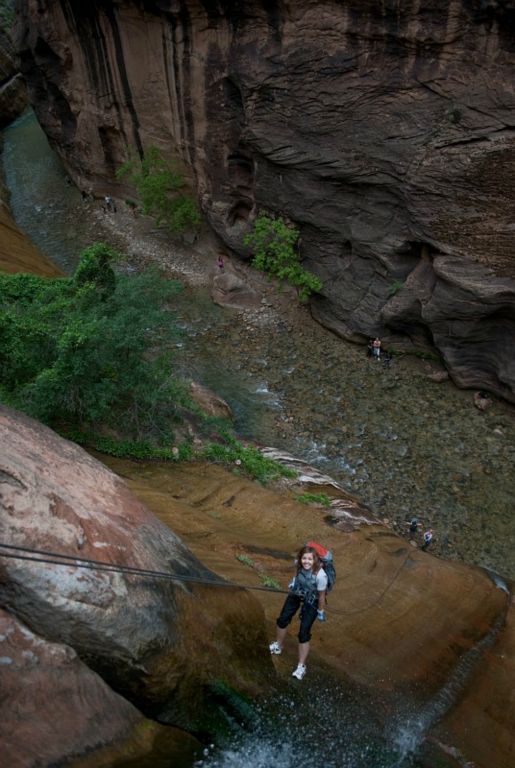 Janel Macy starting down the final rappel of Mystery Canyon in the Zion Narrows
