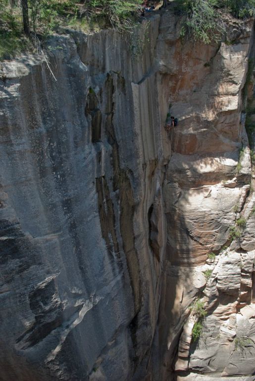 Kate Feller starting the 300-ft rappel in Englestead Canyon.