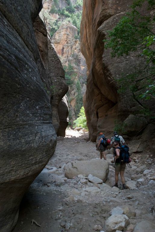 Kate Feller, Chad Utterback, and Megan Porter hiking down Orderville Canyon.