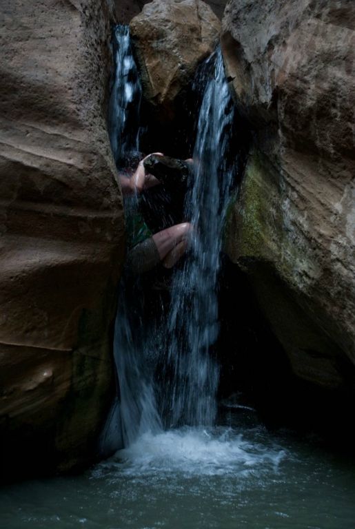 Kate Feller climbing Orderville Canyon waterfall.