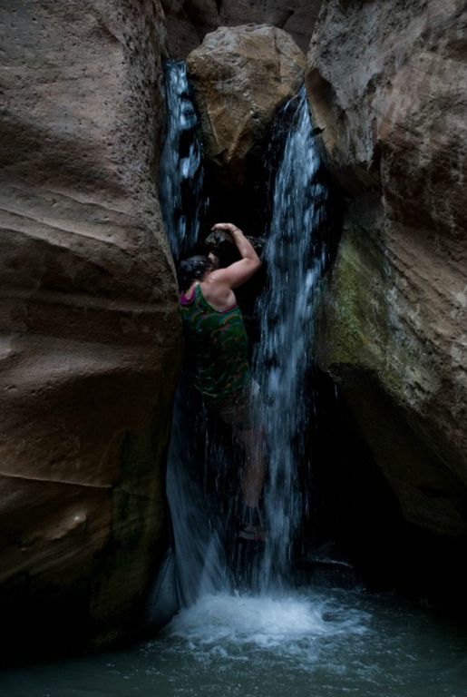 Kate Feller climbing Orderville Canyon waterfall.