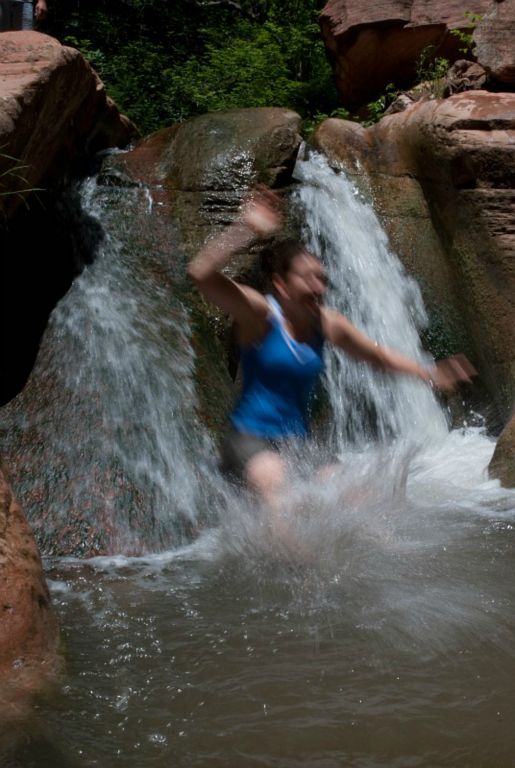 Megan Porter sliding into pool in the Kanarra Creek.