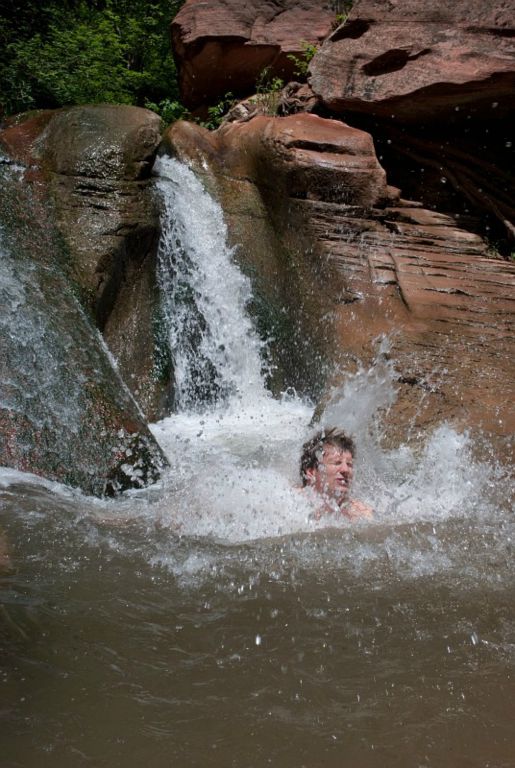 Jon Jasper sliding into pool on the Kanarra Creek.